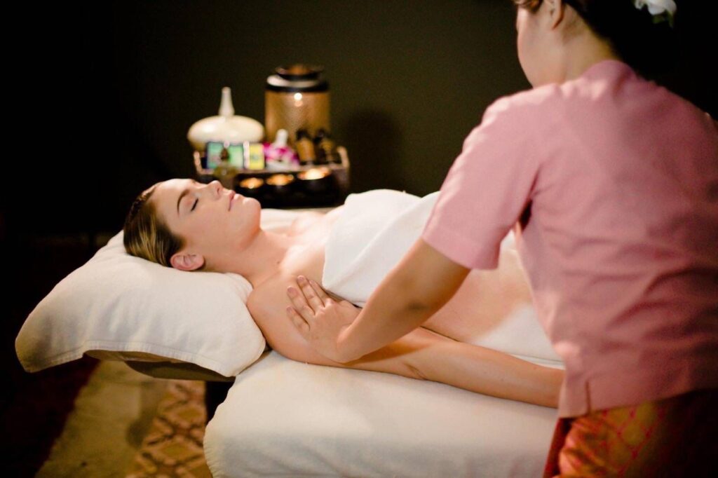 Hot stone therapy massage treatment in progress at Dusita Spa Koh Samui