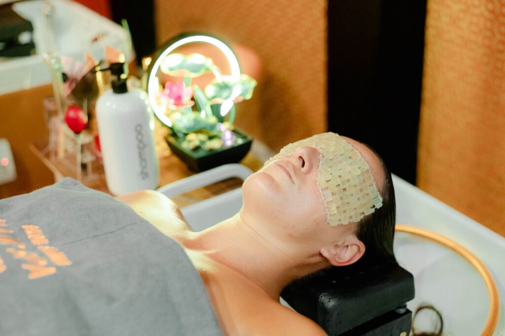Guest receiving ASMR sound therapy during Dusita Spa head spa, Koh Samui — stress hormone reduction