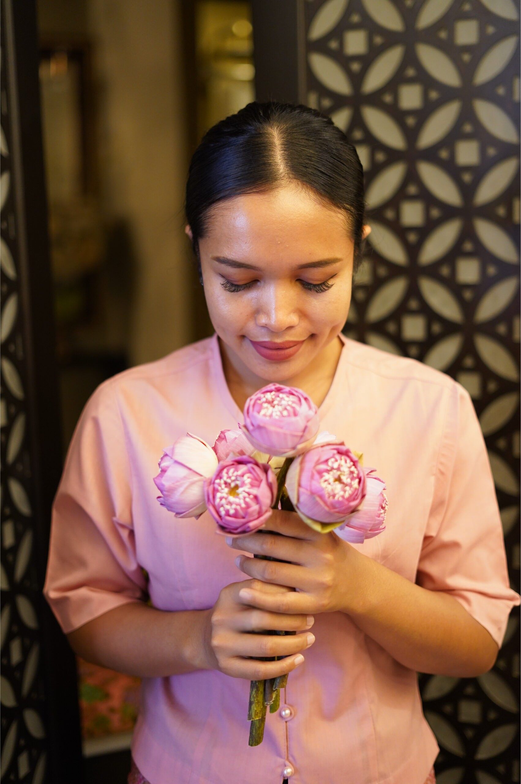 A guest being welcomed for a luxury spa treatment at Dusita Spa, Chaweng, Koh Samui